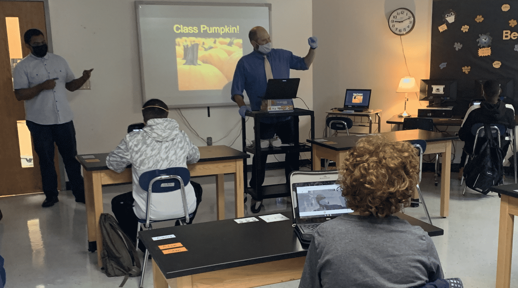 A teacher teaches in a covid-safe classroom