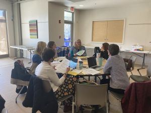 Group of teachers collaborating at a round table